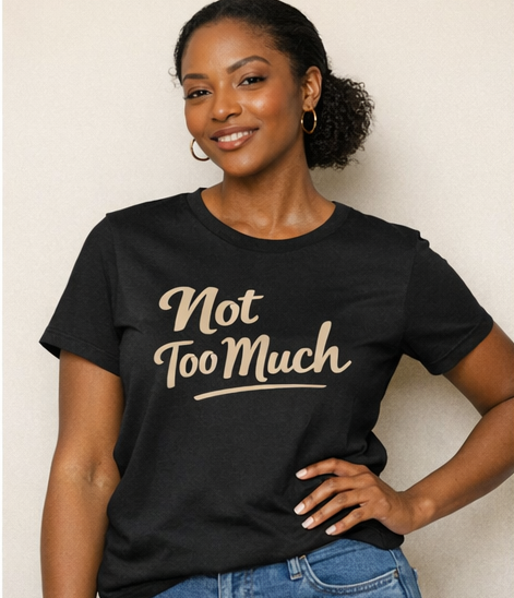 image of two girls sitting on a sofa smiling at each other with wearing t-shirts with words printed on the front 